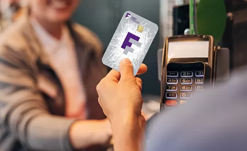 close up of Fort Financial credit card being used at tap-to-pay system