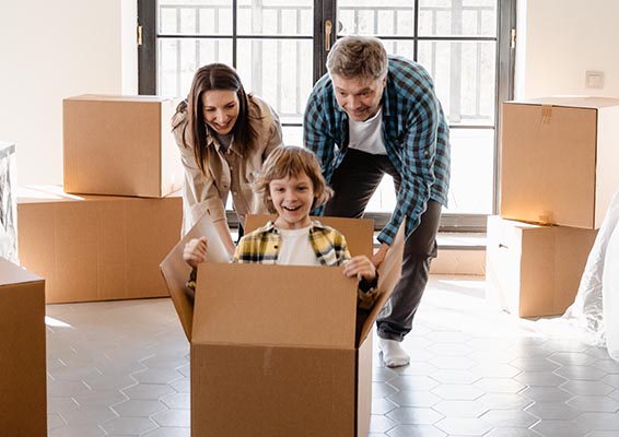 Family unpacking boxes